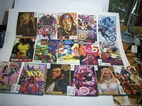 All 15 comic books laid out, covers visible
