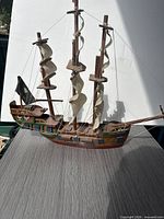 Full starboard view of wooden model ship on table
