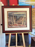 Full view of framed print on easel