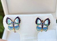 Front view of both butterfly clip-on earrings