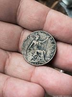 Reverse showing seated Britannia, date 1911 and HALF PENNY legend