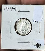 Reverse side showing Bluenose schooner, date, denomination in 2×2 flip