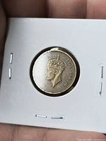 Obverse view showing King George VI portrait