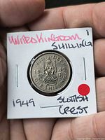 Reverse showing crowned lion on crown with date 1949 in 2×2 holder