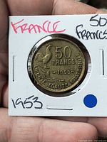 Obverse of 1953 50 Francs coin in cardboard flip