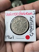 Reverse in flip with Tudor rose design and denomination