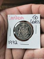 Front view of 1972 Canadian 50¢ coin in holder