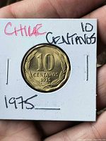 Obverse showing denomination 10 Centavos 1975 in wreath within cardboard flip