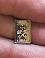 Obverse of silver bar showing markings and crossed keys design
