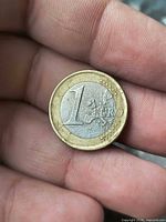 Reverse side of 1 Euro coin showing denomination and map design