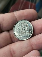 Reverse of 2006 New Zealand 50 cent coin showing HMS Endeavour and value
