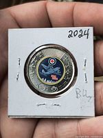 Reverse side showing colorized seaplane design and denomination