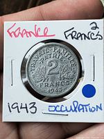 Obverse of 1943 French 2 Francs aluminium coin in cardboard flip