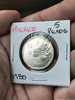 Obverse of 1980 Mexico 5 Pesos coin in flip