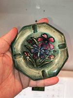 Top view of octagonal Moorcroft ashtray showing floral design and rests