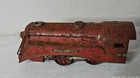 Left side view showing Lionel Lines plate, rust, glass bulb