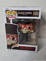 Front of boxed Funko Pop! Movies The Grabber figure