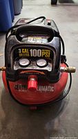 Front view showing gauges, regulator, branding and 3 gal 100 PSI labeling