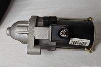 Side view of starter showing full assembly with barcode label