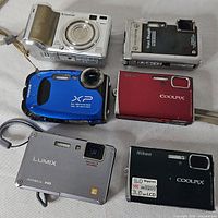 Front view of six compact digital cameras