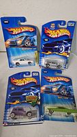 Group shot of four sealed Hot Wheels packages