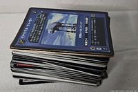 Side view of entire stack of Star Wars cards showing blue back of top card with Japanese text