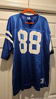 Full front view of blue #88 Champion Colts jersey on hanger
