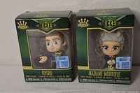 Front view of both boxed figures Fiyero and Madame Morrible
