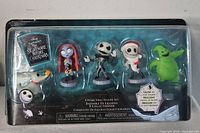 Front view of sealed Nightmare Before Christmas collectible figure set showing all five characters in package