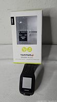 Watch with retail box front showing model details