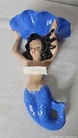 front view of ceramic mermaid wall pocket