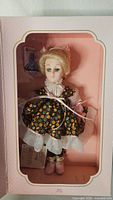 Doll in original box showing full outfit and condition