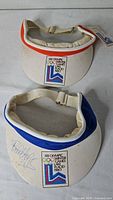 Top view of both visors showing colour trims and logo patches