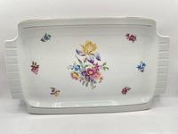 Top view of rectangular porcelain platter showing floral pattern and gold trim