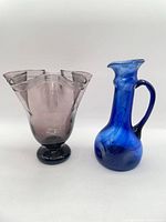 Amethyst vase and cobalt pitcher side by side