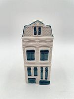 Front view of Delft Blue House miniature showing façade detailing