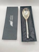Spoon in open branded box