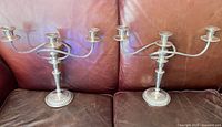 Both candelabra fully assembled on sofa