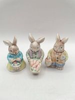 Front view of all three pastel ceramic bunny figurines