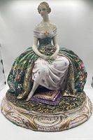 Full view of porcelain figurine on base