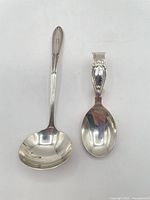 Ladle and baby spoon side by side