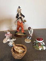Group shot showing all six figurines arranged together