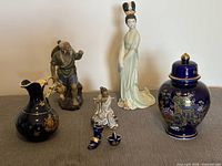 Group shot of all seven cobalt and porcelain items