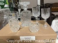 Group view of decanter, two goblets, creamer and sugar bowl on box