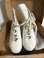Pair of white Jackson Ultima SoftSkate figure skates in box, frontal view
