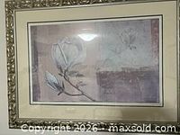 Full view of framed floral print showing artwork, matting, and frame