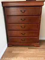 Front view showing five drawers and hardware