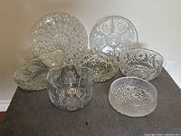 Group shot of all seven clear pressed/cut glass items