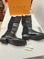 Full view of both boots laid flat showing uppers and Unisa box