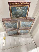 Five sealed Museum Collection Van Gogh Almond Blossom 1000-piece puzzles stacked